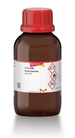 A brown chemical bottle with a red cap, labeled 