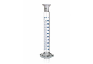 A clear, cylindrical graduated cylinder with blue measurement markings and a spout. The top is sealed with a stopper. The base is hexagonal, providing stability. The cylinder is filled with a clear liquid up to the 100 ml mark.