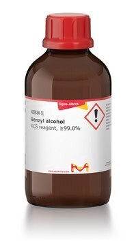 Sigma-Aldrich brand benzyl alcohol, in an amber laboratory glass with a product technical label and a red lid.