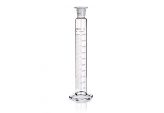 A tall, cylindrical glass graduated cylinder marked with measurement markings up to 500 milliliters. The cylinder has a hexagonal base for stability and a plastic stopper at the top. The numbers are printed vertically along the side for precise liquid measurement.